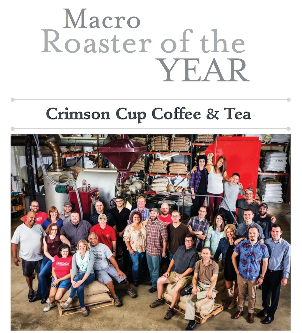 The Crimson Cup team gathers around “Godzilla,” the company’s 325-pound Roure roaster from Spain. Photo courtesy of EclipseCorp.