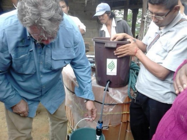 Dave Day (left) helping install water filtration systems supplied by Growers First to farmers in Oaxaca. 