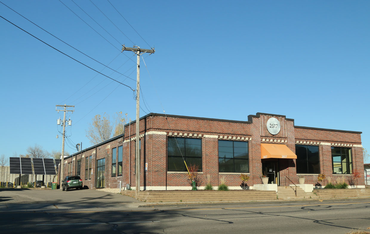 The Cafe Imports offices with a 10-kw solar array in the back lot. Photo courtesy of Cafe Imports.