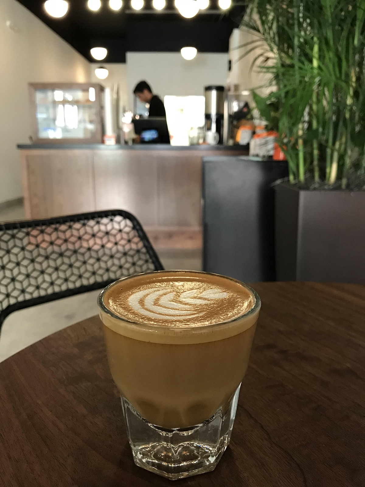 espresso drink with latte art at cafe grumpy in coral gables
