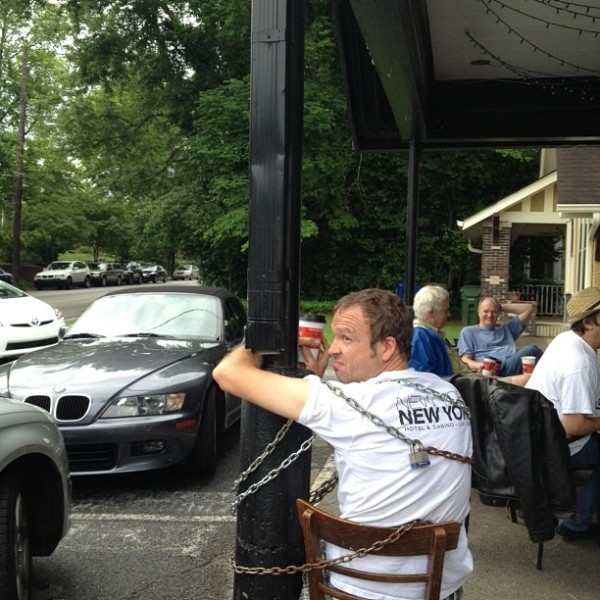 man chains himself to Aurora coffee