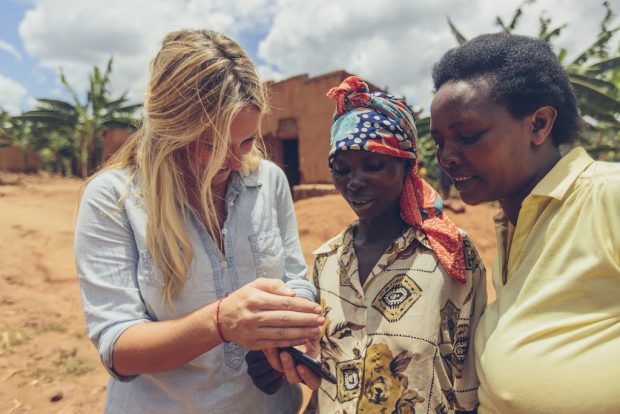 Sarah Buchanan with farmers in Rwanda. 