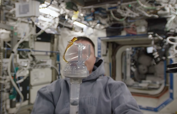Astronaut Kjell Lindgren brewing coffee with a Space Cup at the ISS. 