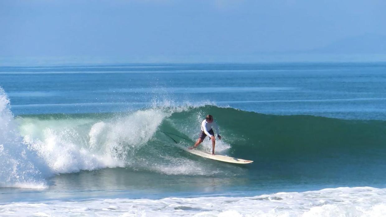 Justin Boudeman surfing